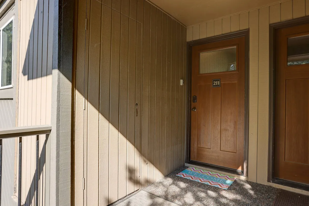 The welcoming front door of Rabbit’s Rest is framed by warm wooden paneling and a cheery welcome mat. The entryway looks inviting and cozy, hinting at comfortable moments awaiting inside after outdoor adventures.